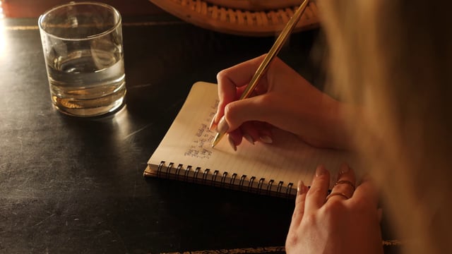 Woman writing in her notebook