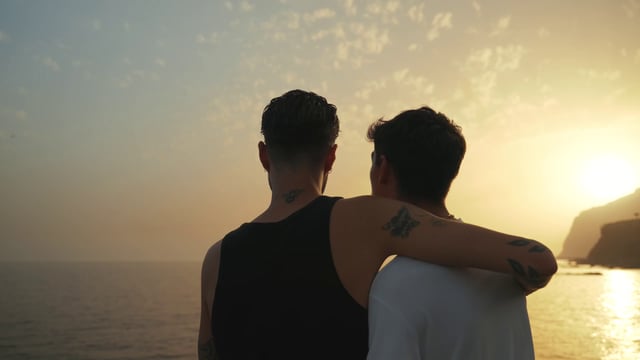 Gay couple at sunset