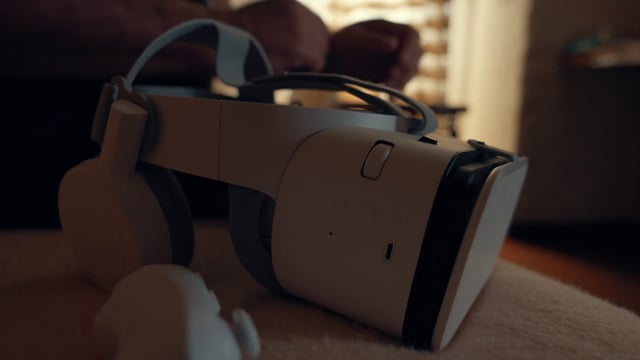 A VR headset on a bed 