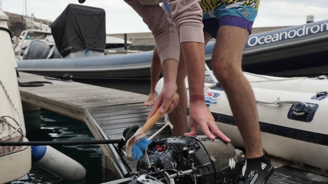 Cleaning a boat with water and soap