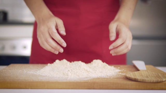 Rubbing hands with flour