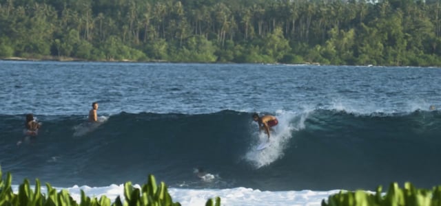 Surfer gets a barrel in Indonesia