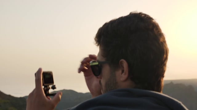 Man checking GoPro footage