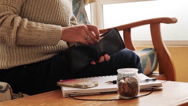 Woman counting her money 