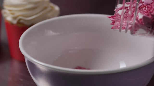 Pouring sprinkles in a bowl