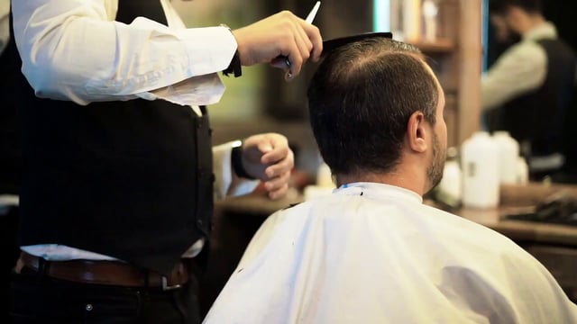 Combing a man's hair