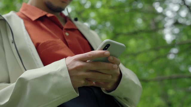 Close-up of a guy using a smartphone