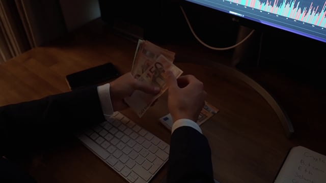 A man counting the profit from an investment