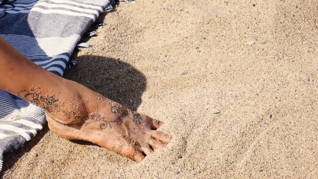 Pies en la arena
