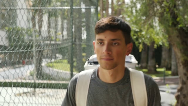 Man walking to the tennis court