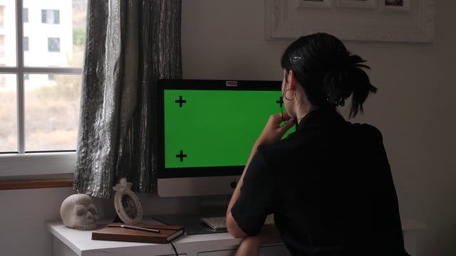 Woman waving on video call