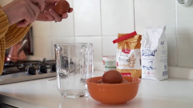 Cracking eggs into jug