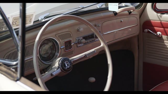 View inside vintage Volkswagen Bug through the driver’s window