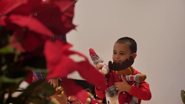 Boy playing with Christmas toys