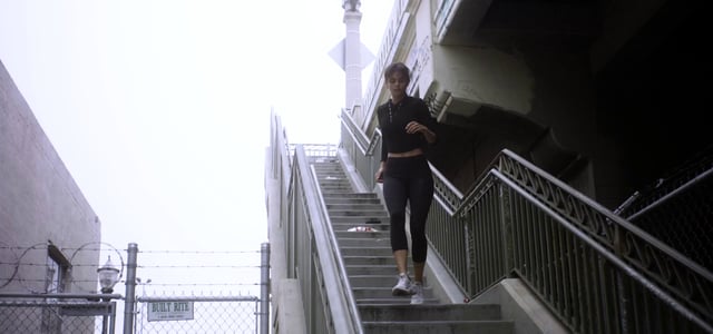 Woman running down steps