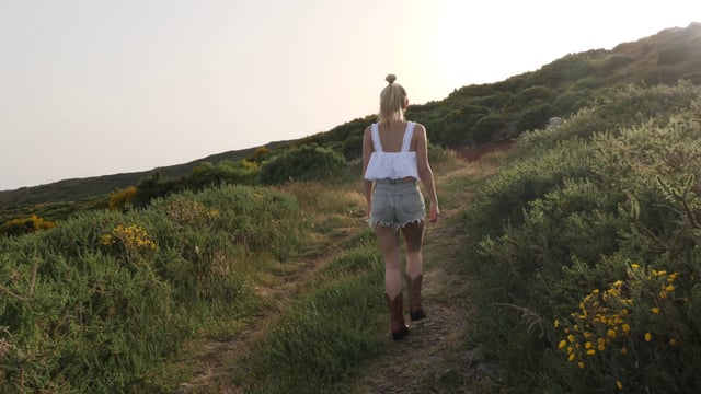 Woman walking uphill