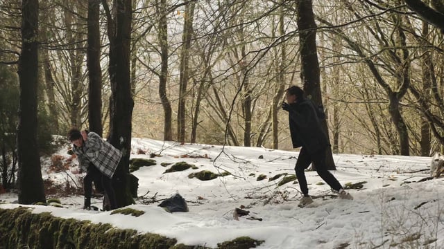 Friends throwing snowballs at each other
