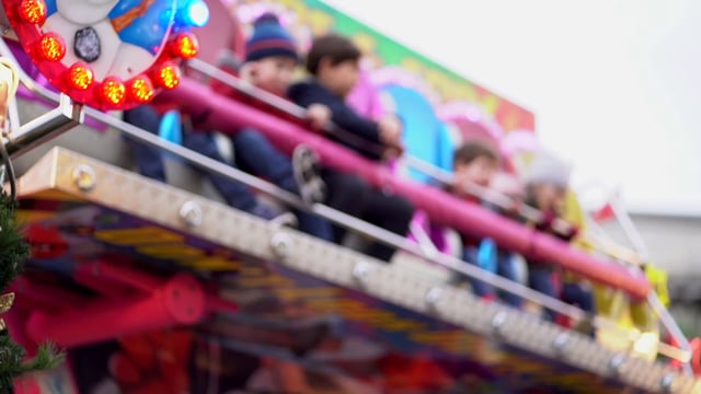Children on amusement park ride 