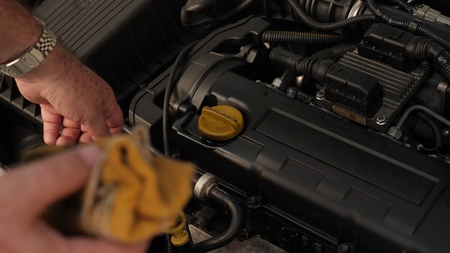 Checking the oil level of a car