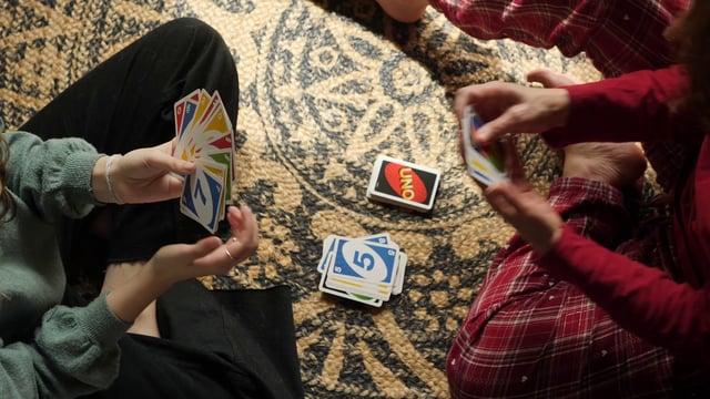 Mother and daughter playing UNO