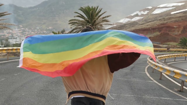 Running with a pride flag