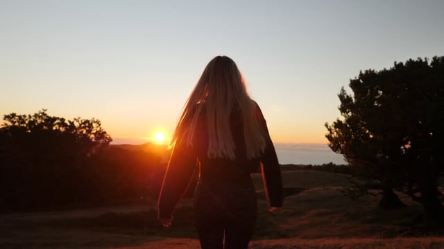 Woman running down a hill