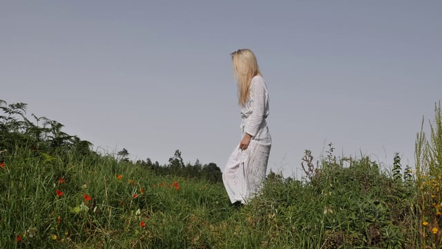 Walking in a field with cowboy boots