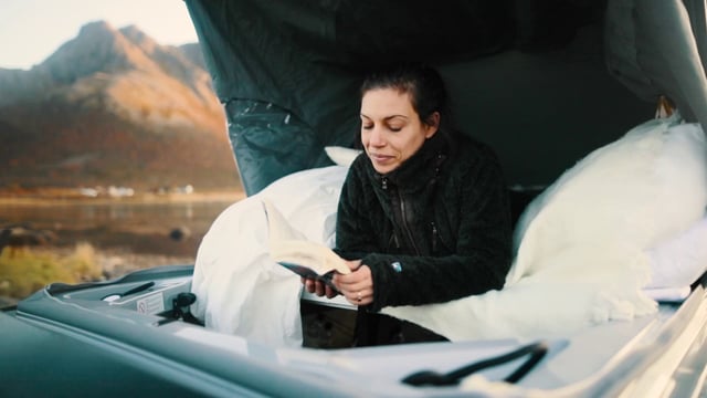 Reading under campervan roof
