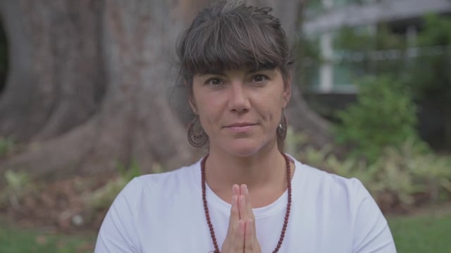 Woman meditating outside