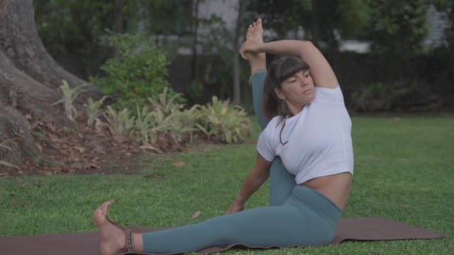 Girl doing an Eight Angle yoga pose