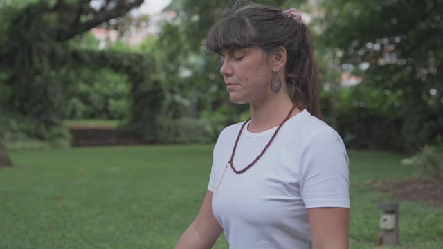 Girl doing a breathing meditation practice outdoors