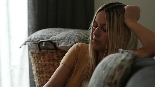 A woman watching TV
