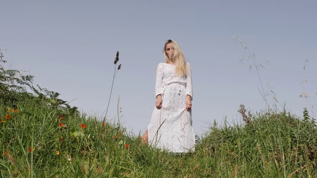 Woman posing in a field 